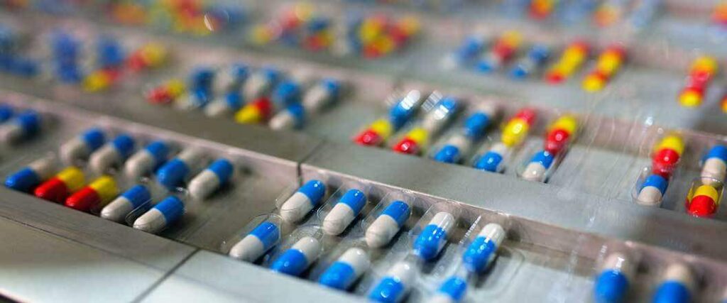 Prescription drug capsules in their packaging