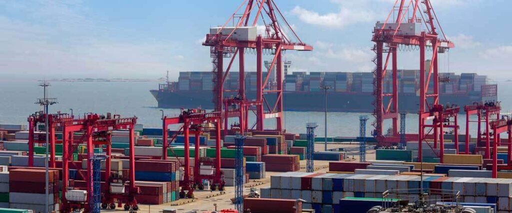 view of container cranes at a cargo ship terminal